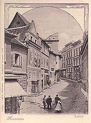 View onto lower part of Latrán Street in Český Krumlov, fountain in the foreground, historical photo 