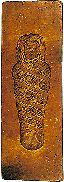 Baker's form shaped like a child in bunting, collection of Regional Museum of National History in Český Krumlov 